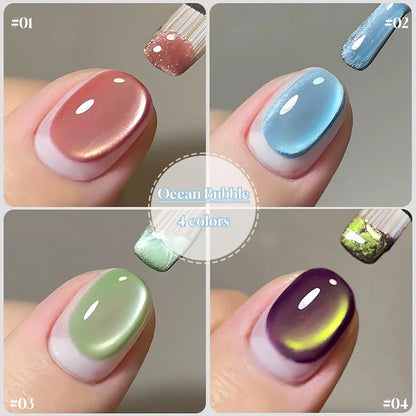 Blue and green cat eye gel nail polish with ocean bubble design, by Blushimmer, for spring and summer nail fashion.