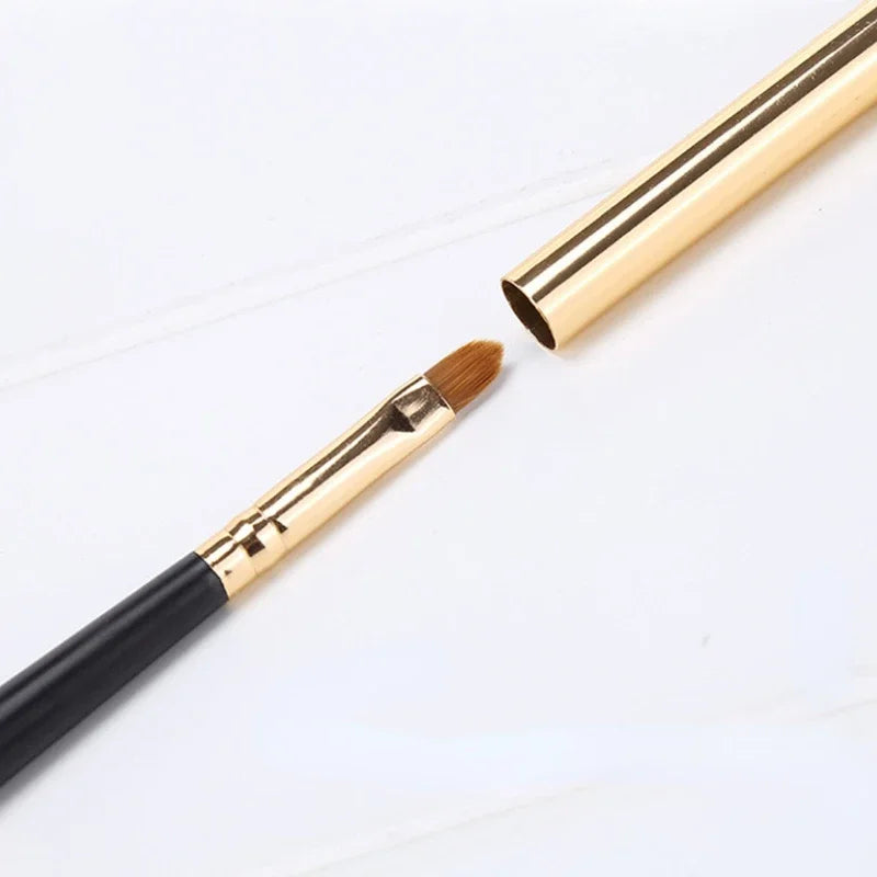 Silver portable Lips makeup brush pen with metal handle and protective cap, ideal for lip gloss and lipstick application by Blushimmer.
