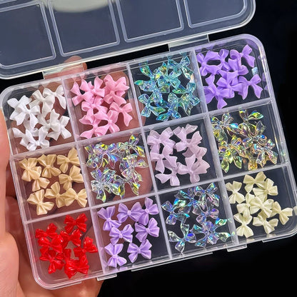 Assorted 3D gold bow, butterfly, and star nail metal charms on a white background for luxury nail art designs.
