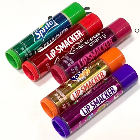 Blushimmer LiP SMACKER X Coca-Cola lip balm in red, with colorful packaging, designed for moisturizing and long-lasting color.
