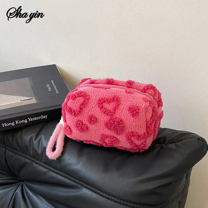 Soft plush makeup bag with handle, portable love print cosmetic organizer, pencil case, and clutch pouch by Blushimmer.