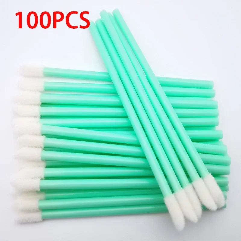 Set of 100 colorful Blushimmer lip brushes and applicators with makeup brushes for lipstick, eyelashes, and cosmetics.