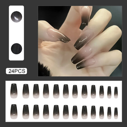 Set of 24 Y2K star press-on nails by Blushimmer featuring gradient black mid-length coffin tips with moon designs