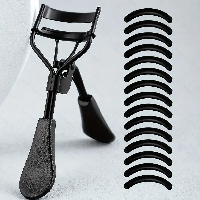 Blushimmer portable eyelash curler with stainless steel body and 15 silicone pads, ideal for eyelash extensions and curling.