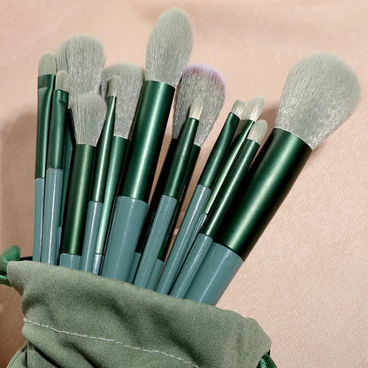 Set of 13 Blushimmer makeup brushes including eyeshadow, foundation, and blush brushes in a soft makeup tools bag.