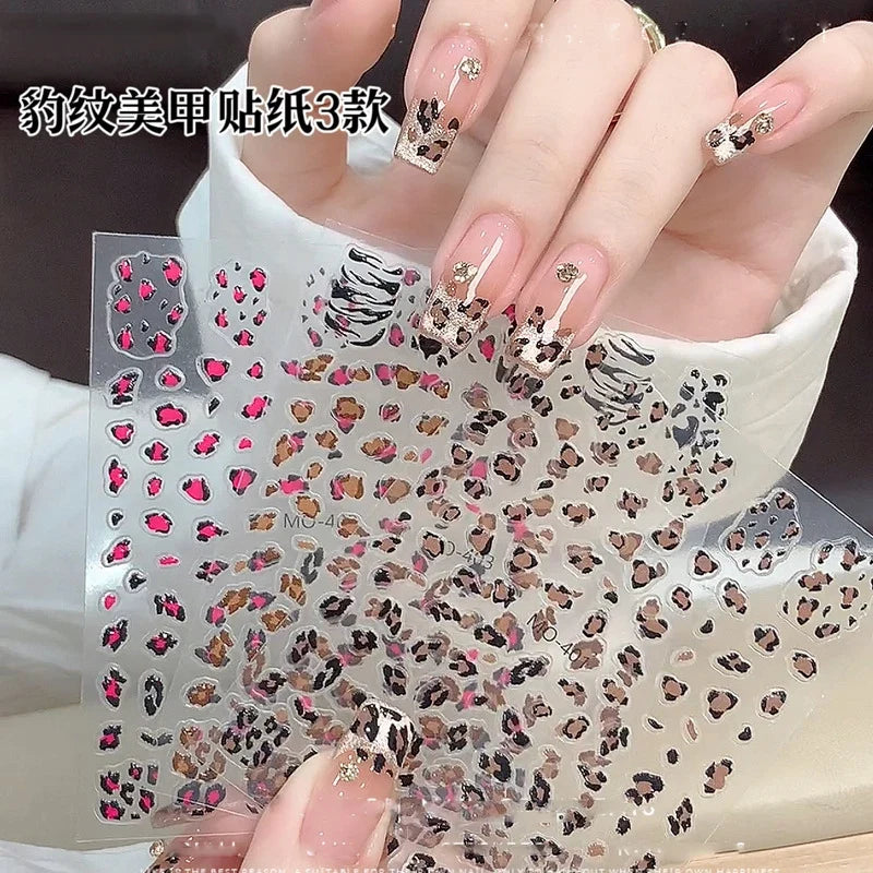 Pink leopard print nail art stickers by Blushimmer, featuring black and brown leopard decals on a 5D design for DIY manicures.