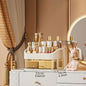 Blushimmer multi-layer makeup storage box with compartments for skincare, eyeshadow, lipstick, and lotions, on a dresser or bathroom countertop.