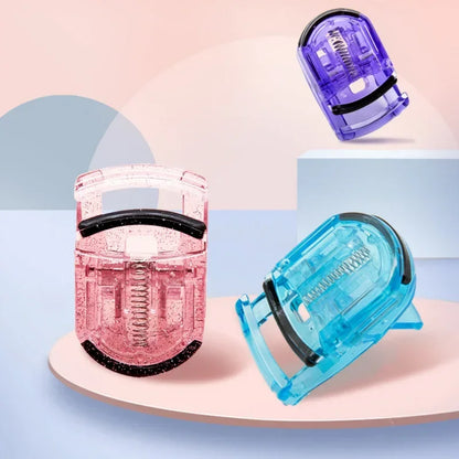 Blushimmer mini eyelash curler in multicolor, folding design with silicone pads, used for curling false and natural eyelashes.