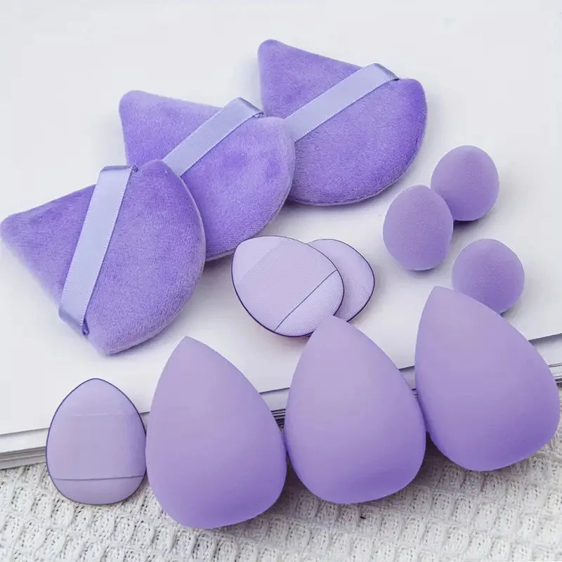 Set of 12 Blushimmer powder puffs featuring soft velour triangle makeup sponges for loose and setting powder application.