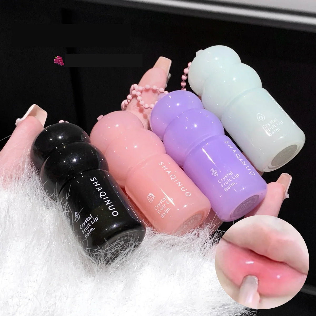 Blushimmer crystal strawberry lip balm stick with hydrating formula, featuring a color-changing lipstick and keychain for lip care.