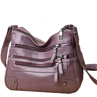 OBA women's purple multi-layer leather shoulder crossbody bag with multiple compartments and adjustable strap.