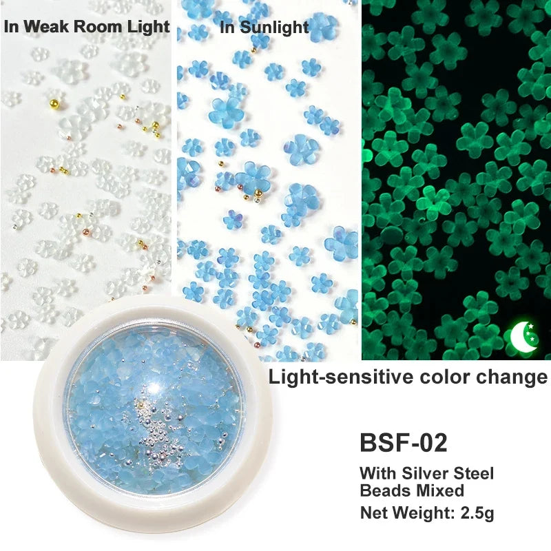 White acrylic flower nail art decorations with mixed-size red and blue rhinestones for DIY manicure designs by Blushimmer.