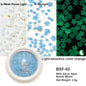 White acrylic flower nail art decorations with mixed-size red and blue rhinestones for DIY manicure designs by Blushimmer.
