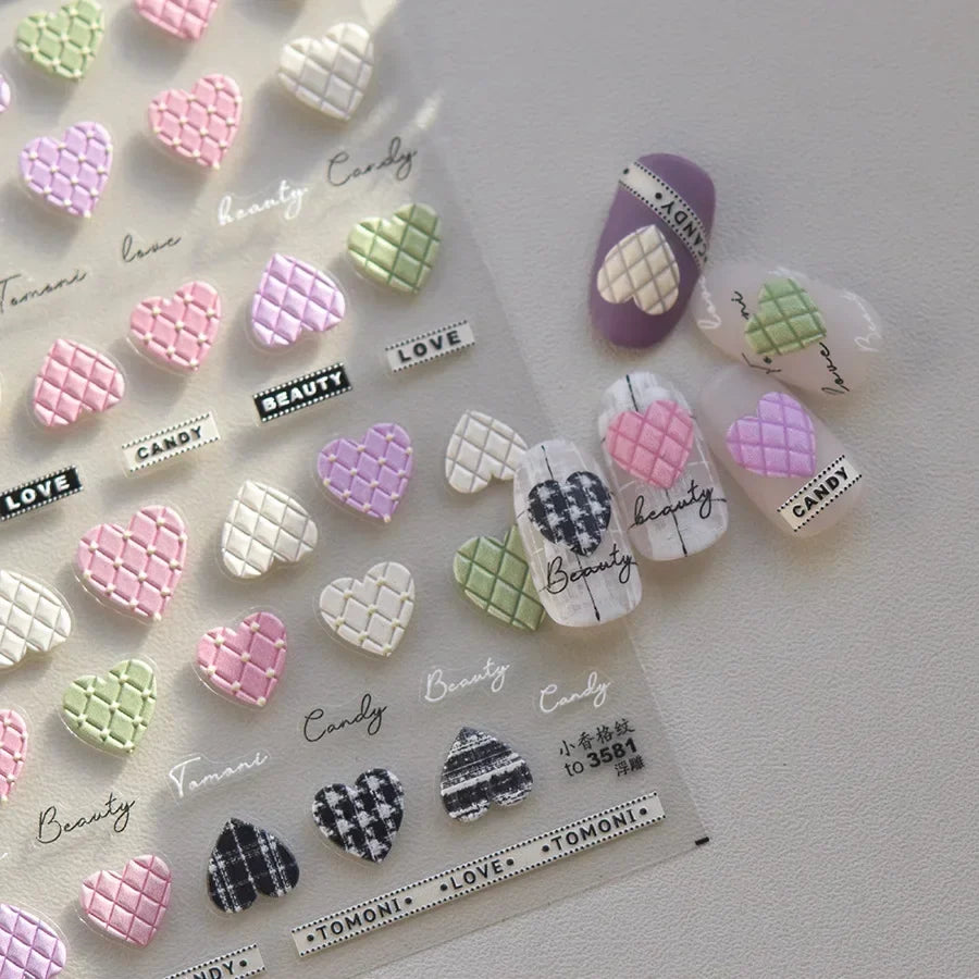 Colorful Cat's Eye 5D gradient European love heart gem nail art stickers with wing and geometric designs by Blushimmer on a manicure.