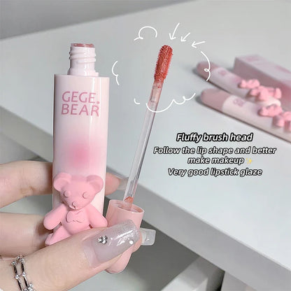 Blushimmer cute bear lip glaze mist and matte velvet lipstick with whitening and color-enhancing lip cream, held in hand.