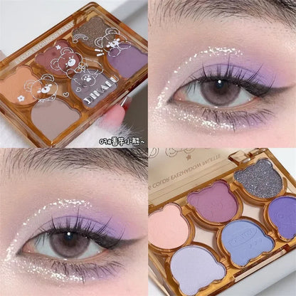 Blushimmer 6-color matte eyeshadow palette with shimmering shades in smoky gray, red, black, and wine red for eye makeup.
