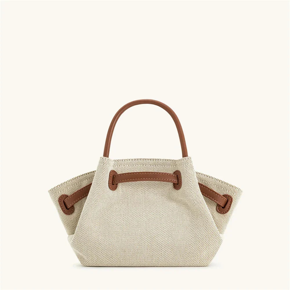 Women's brown canvas mini crossbody shoulder bag by OBA, featuring a compact design and adjustable strap for everyday use.