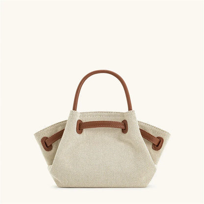 Women's brown canvas mini crossbody shoulder bag by OBA, featuring a compact design and adjustable strap for everyday use.