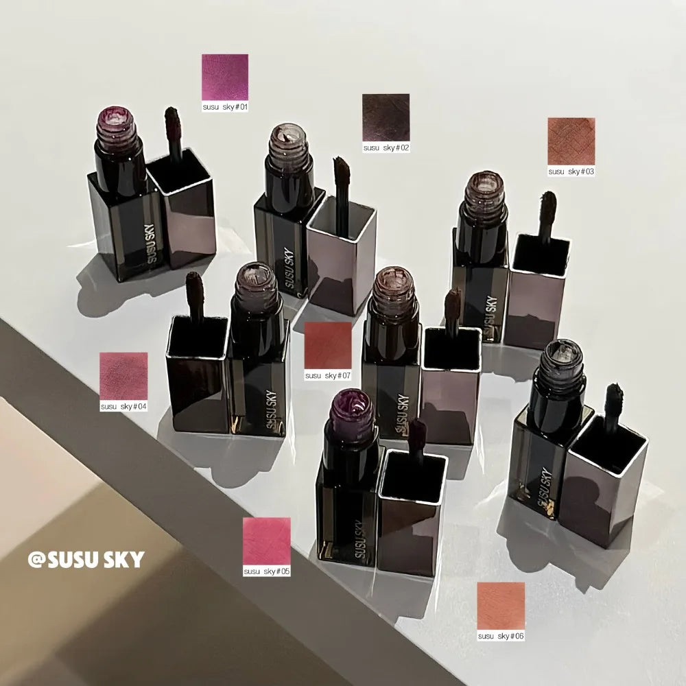 Gothic gray and purple lipstick and lip gloss by Blushimmer, featuring long-lasting, waterproof matte lip mousse in black and brown tones.