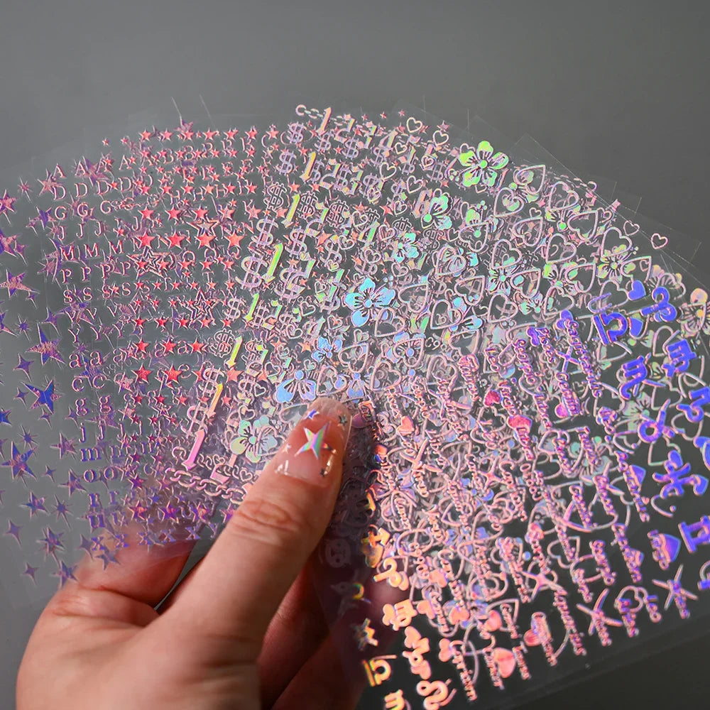 12-pack Blushimmer laser star nail stickers with 3D heart, flower, alphabet designs for DIY gradient manicures and Y2K nail art.