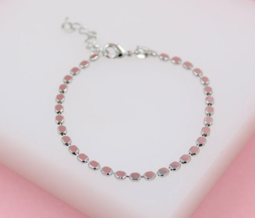 MIA Jewelry 3mm flat ball disc bracelet with silver-tone finish, close-up of sleek, minimalist design on wrist.