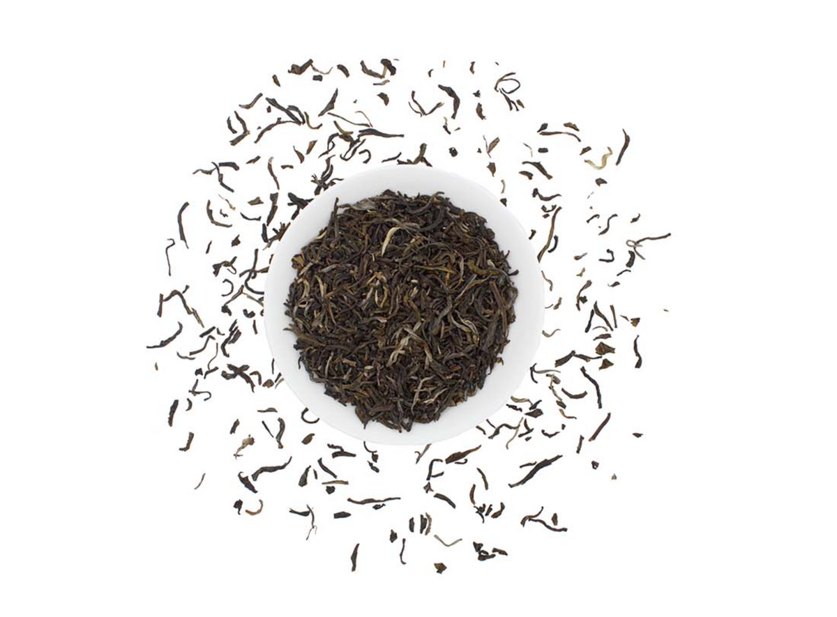 Loose leaf Organic Jasmine Green Tea by Good Brothers Coffee LLC, showing fresh green tea leaves infused with jasmine flowers.
