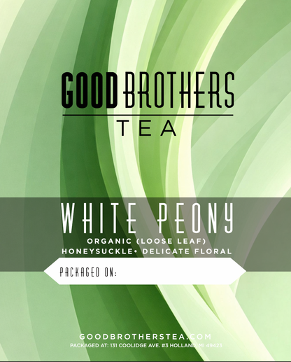 Organic white peony tea from Good Brothers Coffee LLC, white leaf loose leaf tea with delicate white peony blossoms.