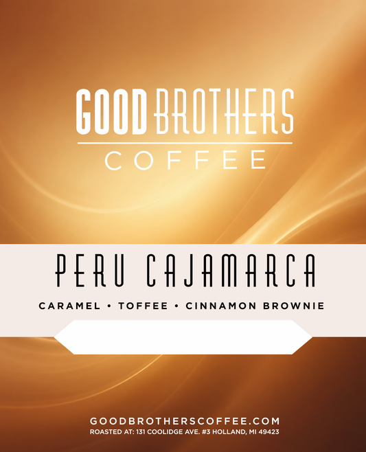Roasted Peru Cajamarca coffee beans from Good Brothers Coffee LLC displayed in a clear container.