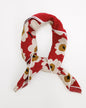 Light, breathable Downeast Essential Summer Scarf in vibrant colors, styled loosely on a model for warm-weather wear.