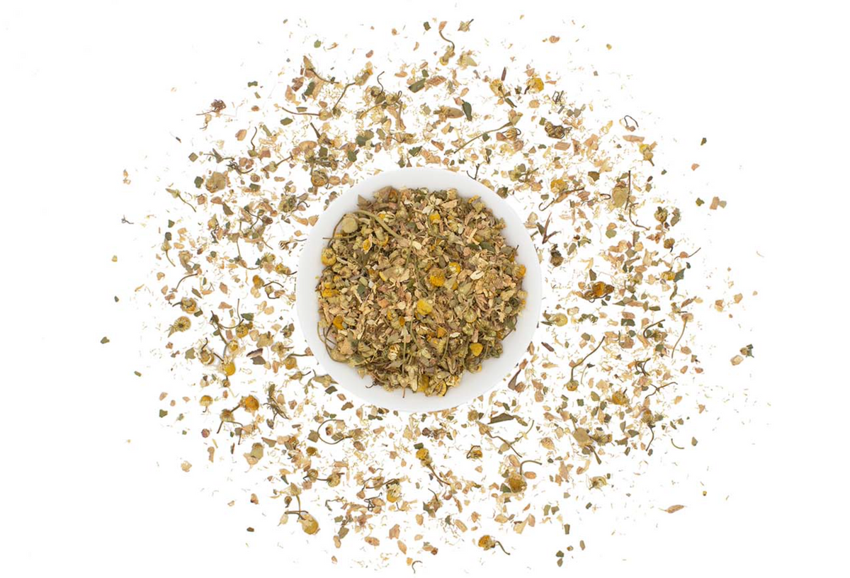 Loose leaf Organic Chamomile Ginger Tea from Good Brothers Coffee LLC, showing dried chamomile flowers and ginger pieces.