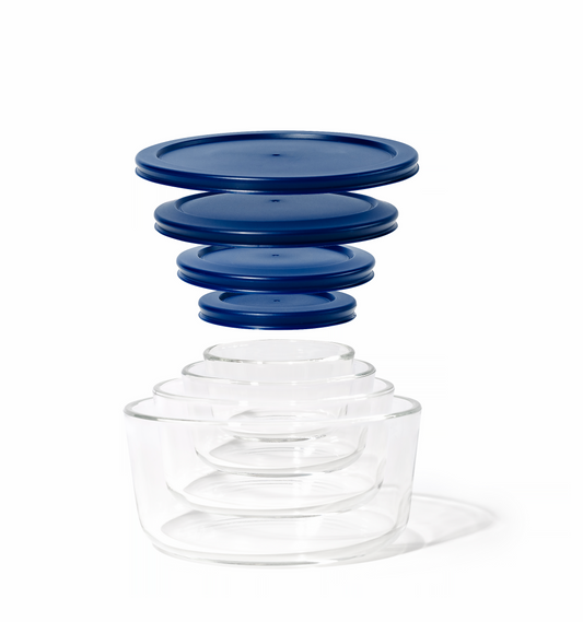 Set of four blue round glass storage containers with matching lids from Dura Living, nesting design for kitchen organization.