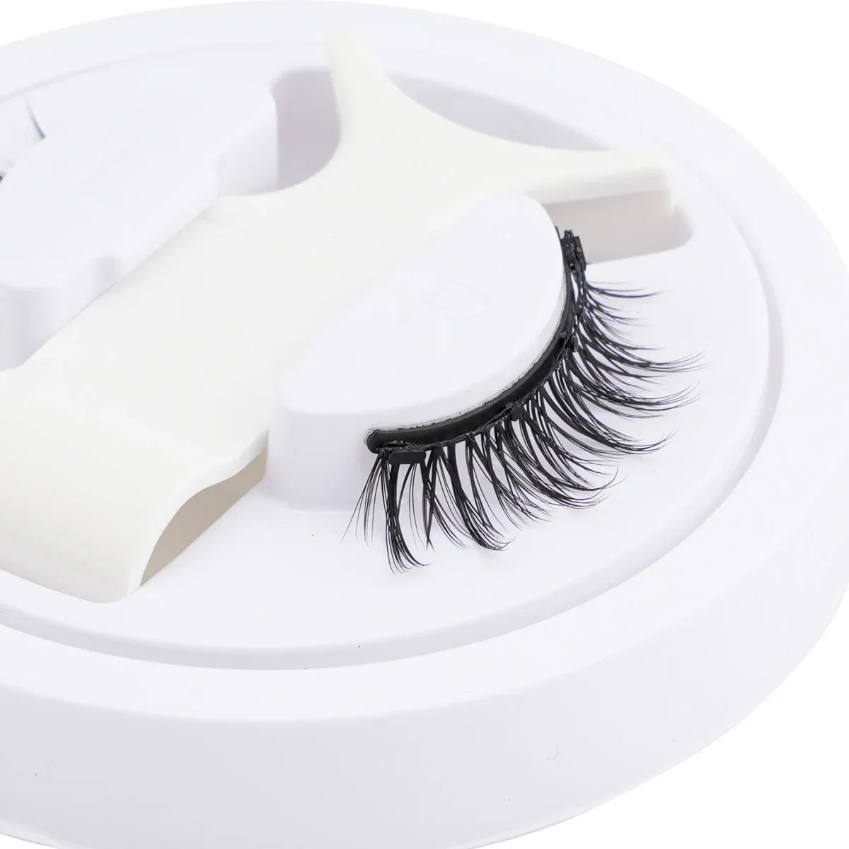 Blushimmer magnetic false eyelashes set with handmade fluffy faux mink lashes and magnetic tweezers on a white background.