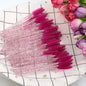 Set of 50 eyelash and eyebrow brushes from Blushimmer, including mascara wands and spoolers for false eyelash extensions.