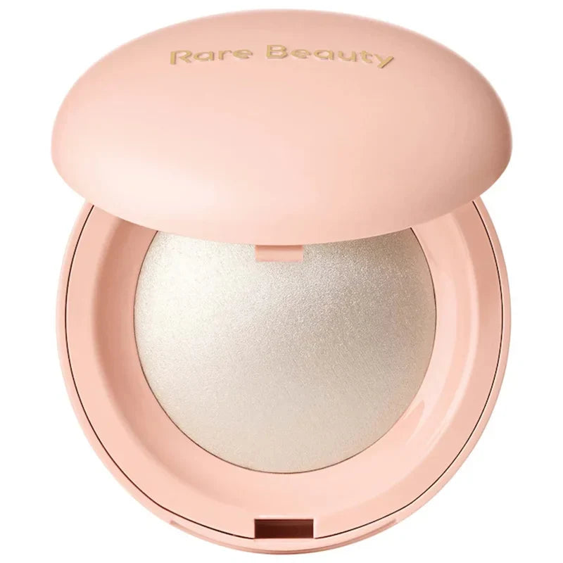 Blushimmer Rare Beauty Positive Light Liquid Contour and Highlight makeup with a shimmering, luminous finish on a face.