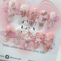Wine red almond press-on nails with cartoon rabbit, bowknot, plaid, and pearl designs by Blushimmer for girls.