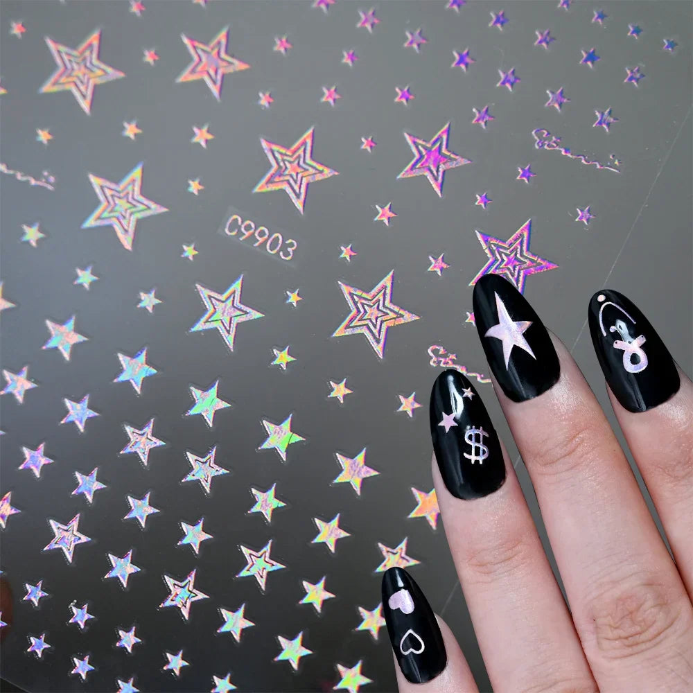 12pcs Blushimmer bronzing laser star nail stickers with 3D alphabet, heart, flower designs for DIY gradient manicures and nail art.