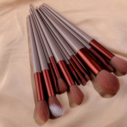 Set of 13 Blushimmer makeup brushes including eye shadow, foundation, blush, and beauty tools in a soft cosmetic brush bag.