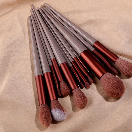 Set of 13 Blushimmer makeup brushes including eye shadow, foundation, blush, and beauty tools in a soft cosmetic brush bag.