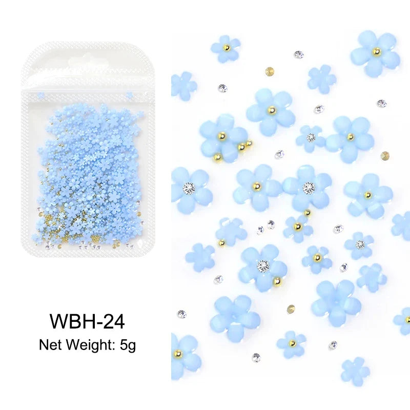 White acrylic flower nail art decorations with mixed size red and blue rhinestones for manicure DIY nails by Blushimmer