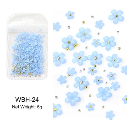 White acrylic flower nail art decorations with mixed size red and blue rhinestones for manicure DIY nails by Blushimmer
