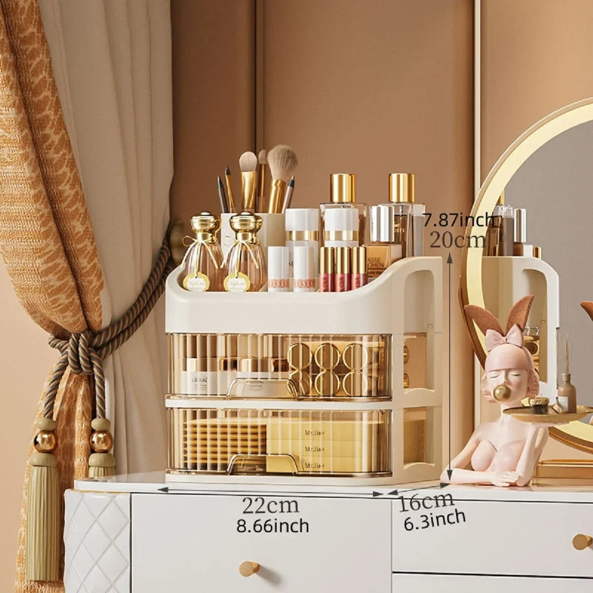Blushimmer multi-layer makeup storage box with compartments for skincare, eyeshadow, lotions, and lipstick on a dresser or bathroom counter.