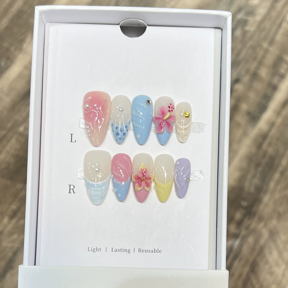 Set of 10 Blushimmer French almond press-on nails with floral design, wearable fake nails for easy manicures and stylish Uñas.
