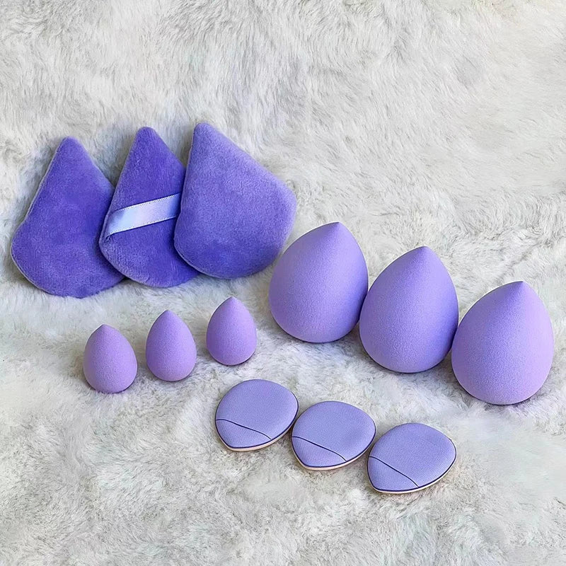 Set of 12 Blushimmer powder puff triangles made of soft velour for setting and blending loose or foundation powder.