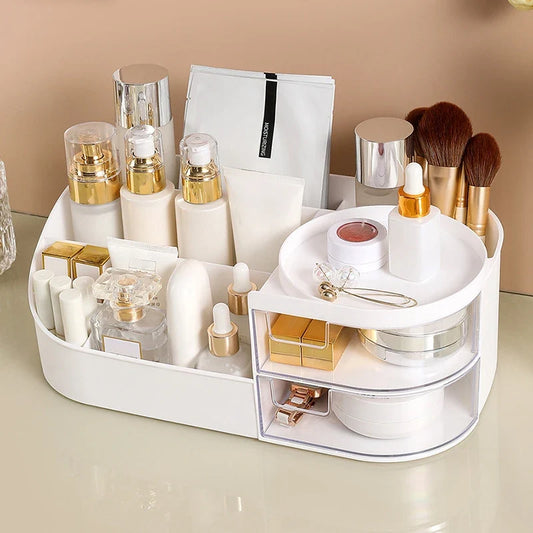 Blushimmer makeup storage box with multiple compartments for cosmetics, jewelry, and nail polish on a desktop.