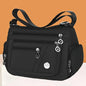 Black OBA ladies crossbody travel handbag with adjustable strap and sleek design, perfect for everyday use.
