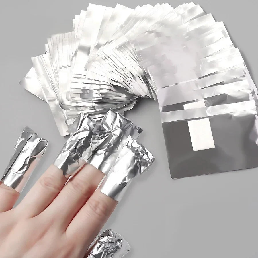 Set of 100 Blushimmer aluminium foil nail art wraps for soak-off gel polish removal with towels and manicure tools.