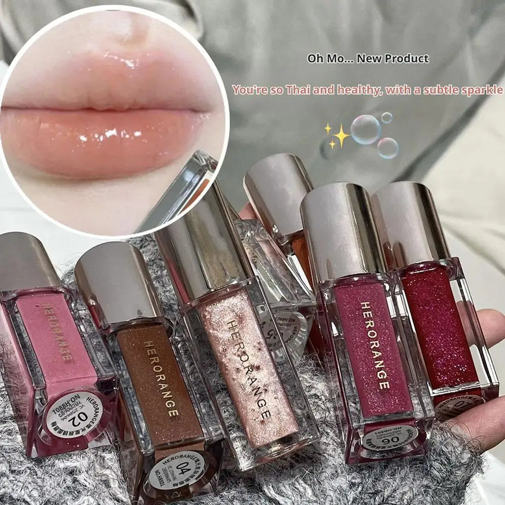 Blushimmer Herorange Starlight lip glaze with shimmer, clear watery formula, lightweight, non-sticky, perfect for everyday or parties.