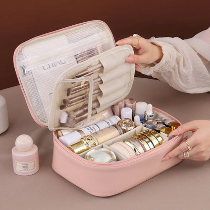 Blushimmer wholesale PU large capacity tote makeup bag with double layer compartments for travel and cosmetic storage.