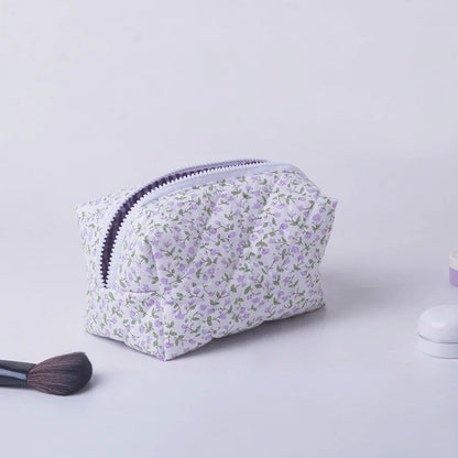 Blushimmer floral quilted makeup bag with puffy design, large travel cosmetic pouch, flower print, perfect for storing makeup and accessories.