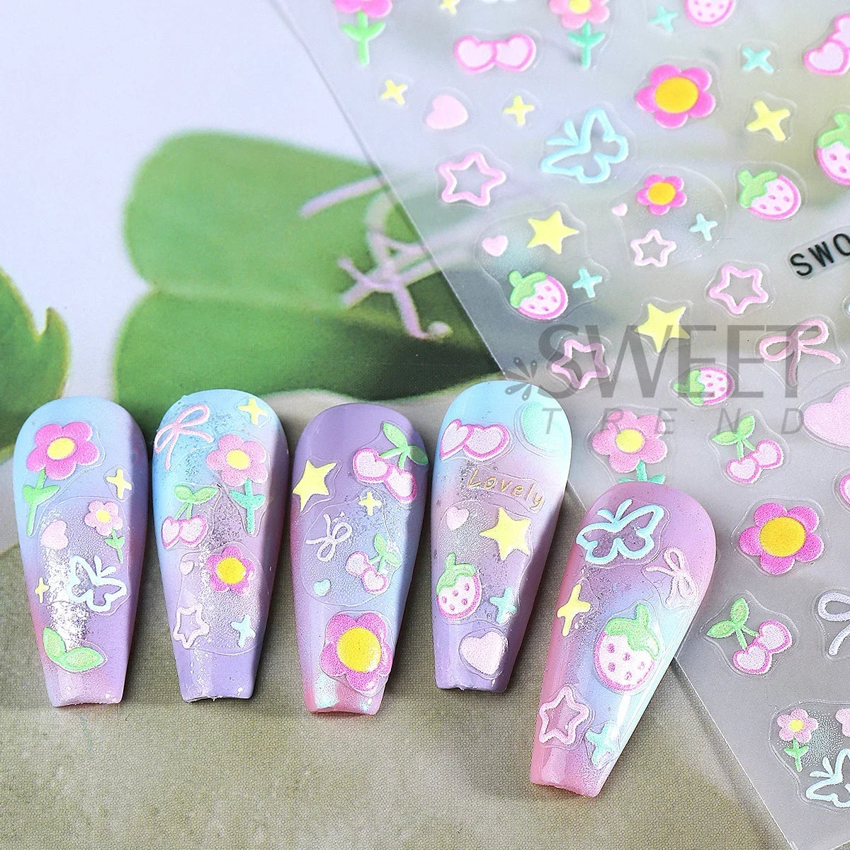 Colorful Blushimmer Sweet Element nail art stickers featuring flowers, hearts, cherries, butterflies, and bows for kawaii manicure designs.